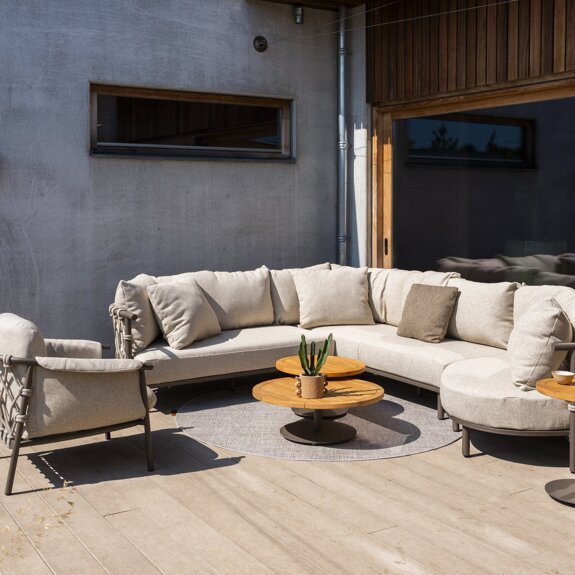 Ezra modular corner with Island and Living chair and Volta tables Terre outdoor 01.jpg