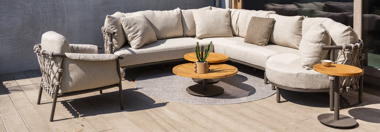 Ezra modular corner with Island and Living chair and Volta tables Terre outdoor 01.jpg